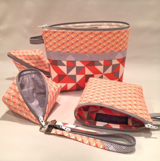 Small zipper pouches in fabrics by #AngelaWalters Sweetpea Pods, Becca Bags, and Fobio key fob by #LazyGirlDesigns