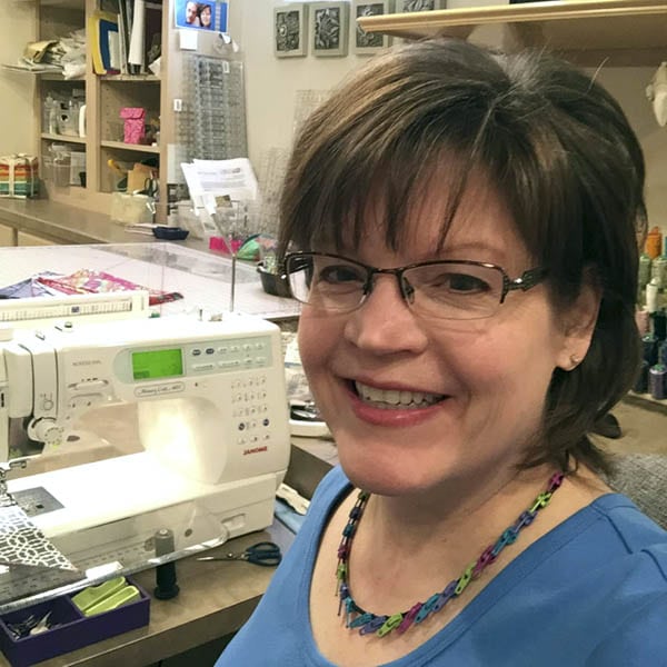 Joan Hawley of Lazy Girl Designs at work in her sewing studio.