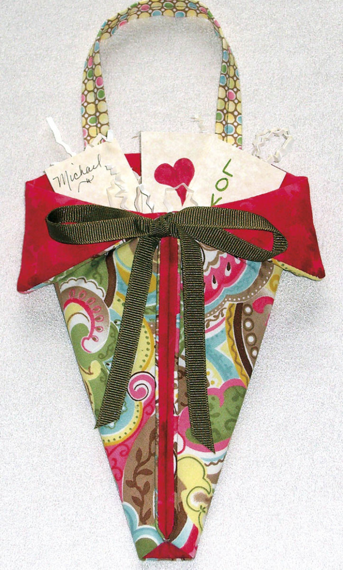 Triangular pouch filled with loves notes for Valentine's Day gifts.