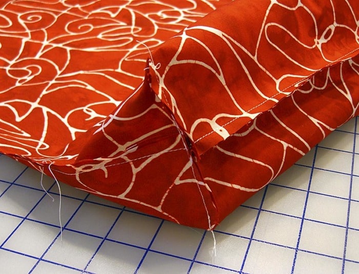 Sew across the cut corner to box the bottom of a bag.