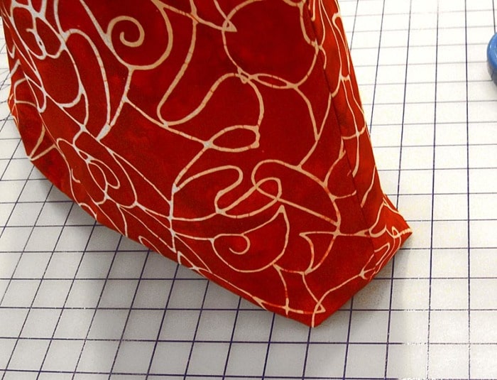 Close-up showing the finished boxed corner of a fabric bag.