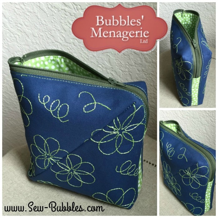 Small zipper pouch with all-over embroidery design on a solid fabric