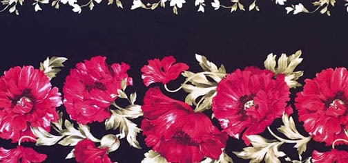 A fabric border print of florals on a black background.