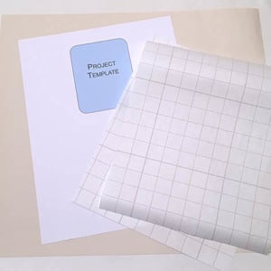 supplies to add iron on vinyl to a paper template