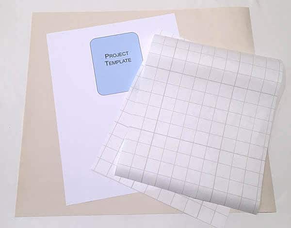 supplies to add iron on vinyl to a paper template