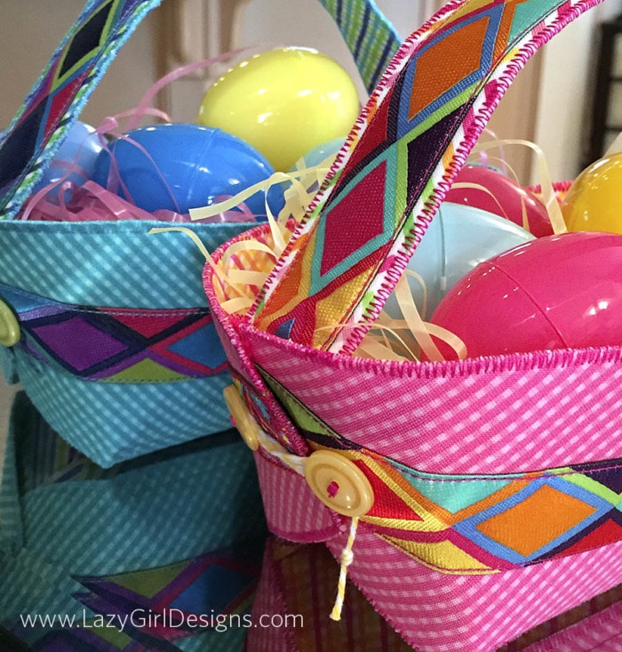 Close up picture of buttons and ties at the end of a Button Boats Easter Basket filled with grass and plastic eggs.