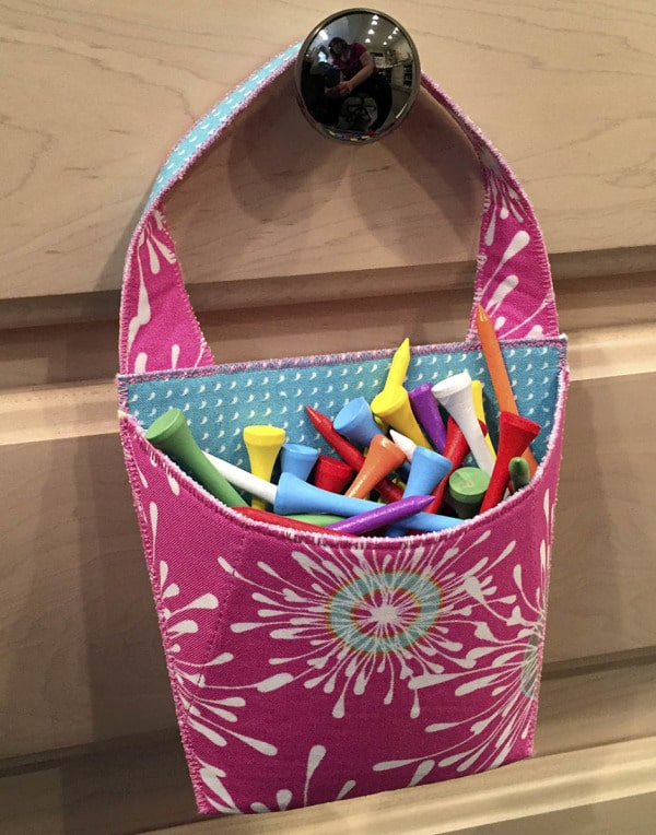 Use a Hang On to organize golf tees in the sewing room.