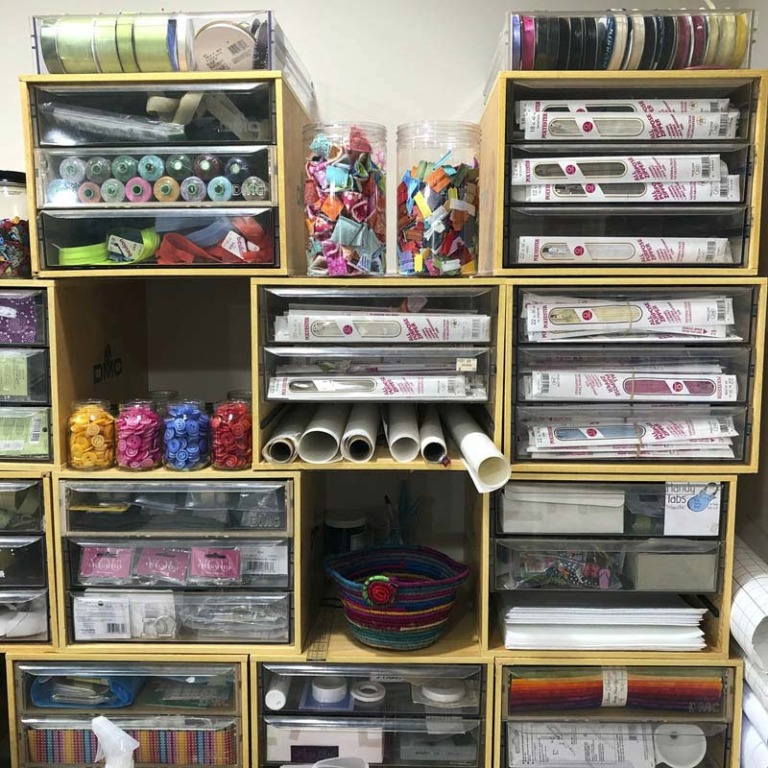 Storage boxes stacked for efficient craft supply organization and storage.