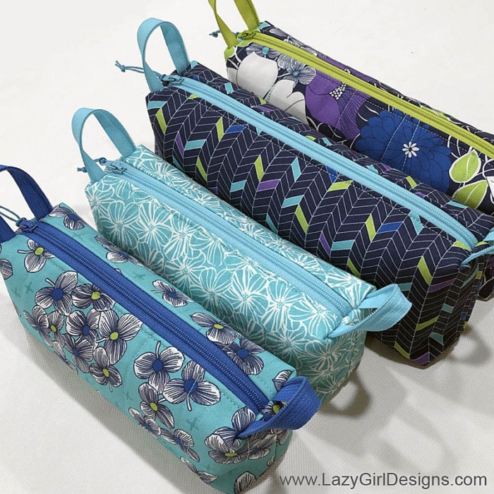 Group of small zipper pouches in coordinating fabrics and zippers