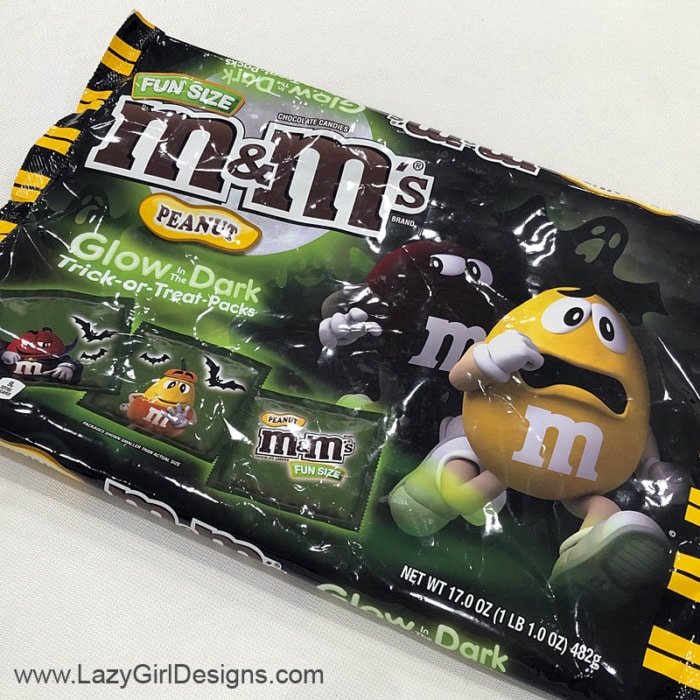 M&M candy in glow in the dark wrappers.