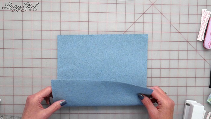 Folding a paper towel to make a face mask